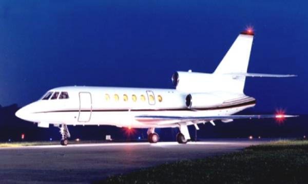 The Dassault Falcon 50 is a French-built long-range corporate jet, featuring a three jet engine layout with an S-duct central engine. The nine-passenger seating configuration is generally laid out in one four-seat club arrangement, and a separate section of two facing seats and a three-seat divan. Work tables fold out between facing seats so work can be completed in-flight. Power plugs are available for laptops and office equipment. Temperature control is separate for the cockpit and the cabin, so both part